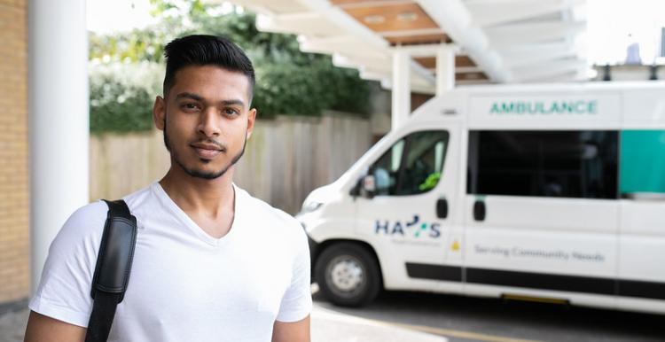 young man standing near a ambulance