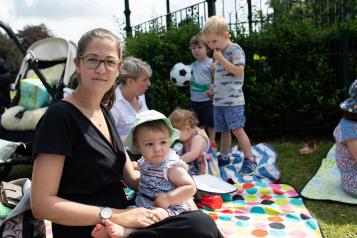 A mother and baby at a community event