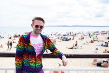 Man looking at the camera on a beach 