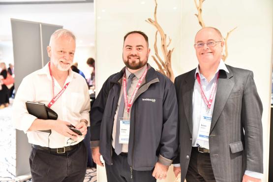 Three Healthwatch staff members at an event